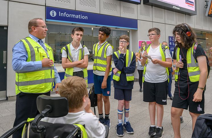 Thameslink Station Manager Steve Lethorn at London Bridge, teaching students from Woodlands Meed School about train travel
