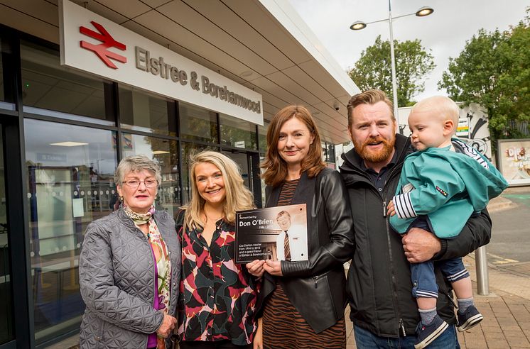 Members of Don O'Brien's family with the memorial plaque Thameslink is placing in the station concourse