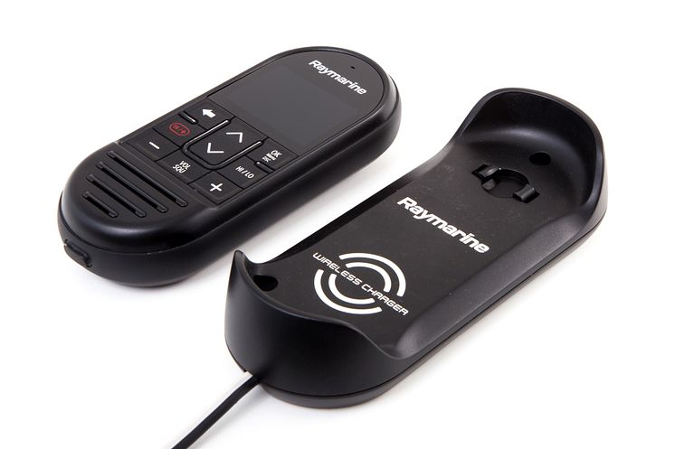 High res image - Raymarine - Wireless handset beside charger