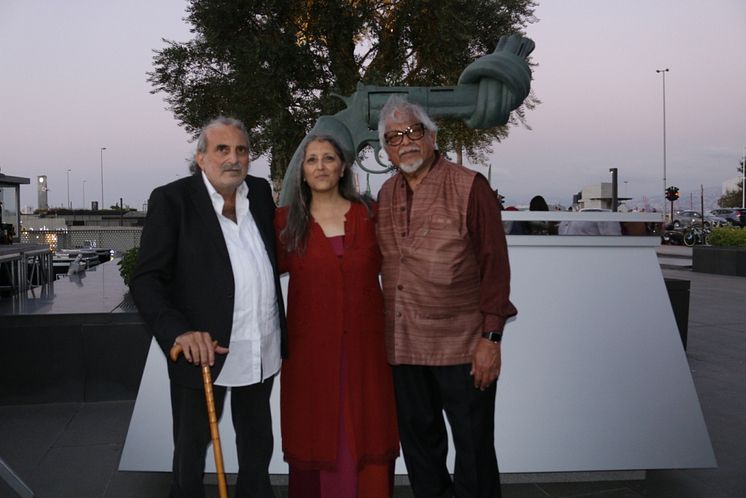Oct 2nd Non-Violence Day Celebration - Founders Dr. Ogarit Younan and Dr. Walid Slaybi with Arun Gandhi in front of the unveiled knotted gun sculpture Non-Violence.