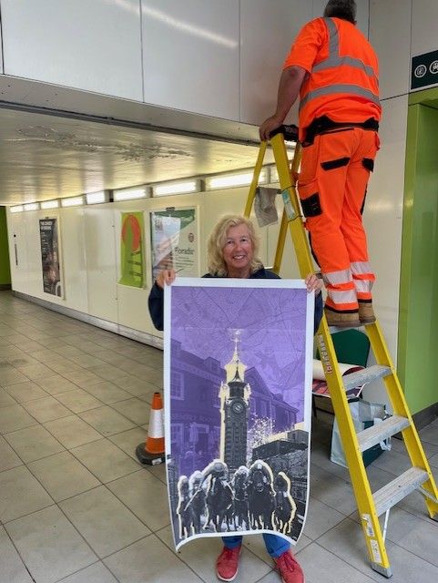 Angie Child with one of the images now on display at Epsom station.jpg