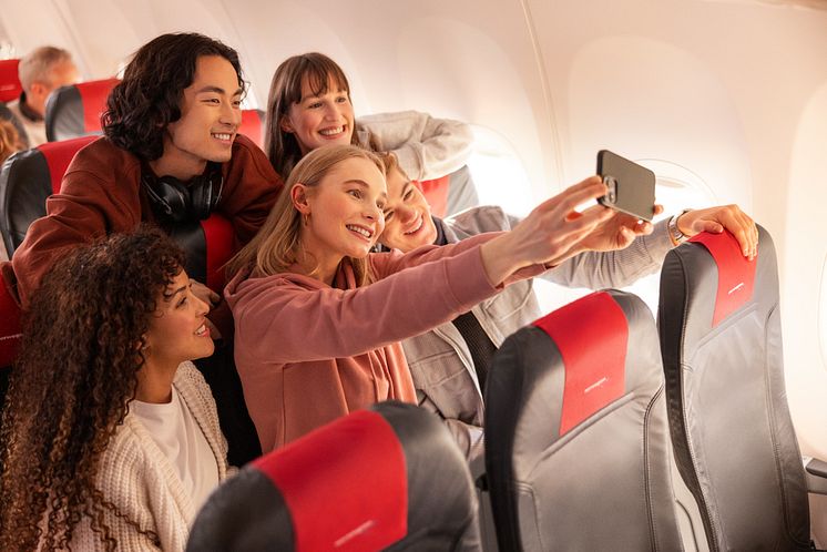 Young people on board Norwegian flight