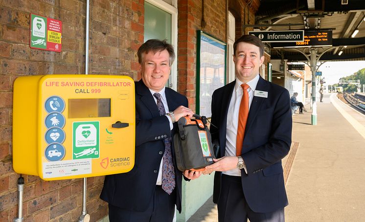 Defibrillators at every station - pictured at Three Bridges station with local MP