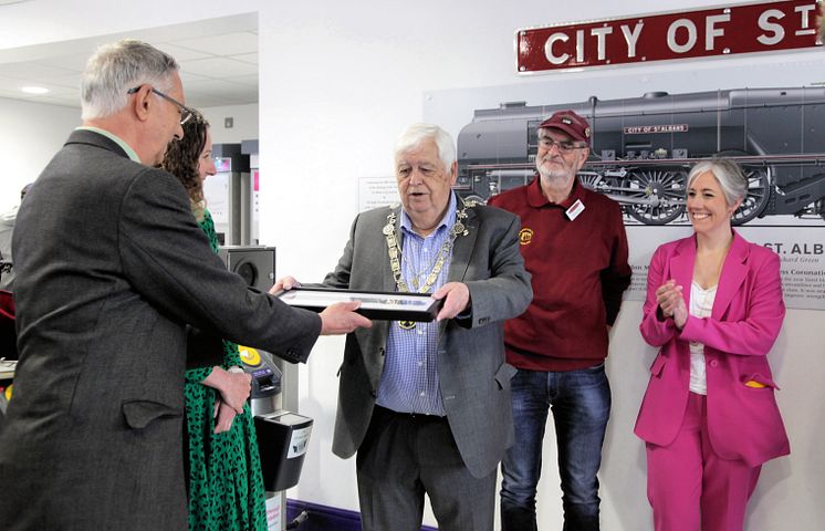Richard Green presents his miniature mural to the Mayor of St Albans