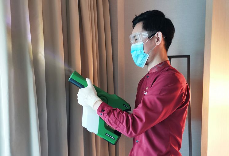 Housekeeping Attendant disfecting guest room at PARKROYAL on Beach Road with the Professional Cordless Electrostatic Handheld Sprayer 2.jpg