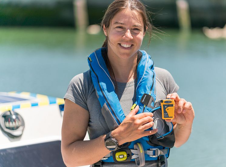 Hi-res image - Ocean Signal - Lia Ditton with the Ocean Signal rescueME PLB1 personal locator beacon