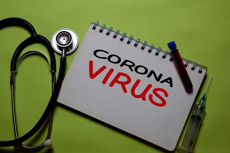 35799213-corona-virus-write-on-a-paperwork-isolated-on-office.jpg