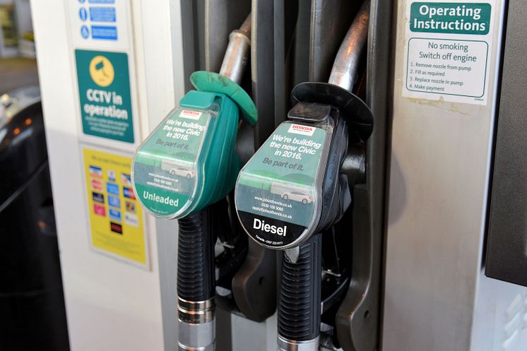 Photo of unleaded petrol and diesel fuel pumps