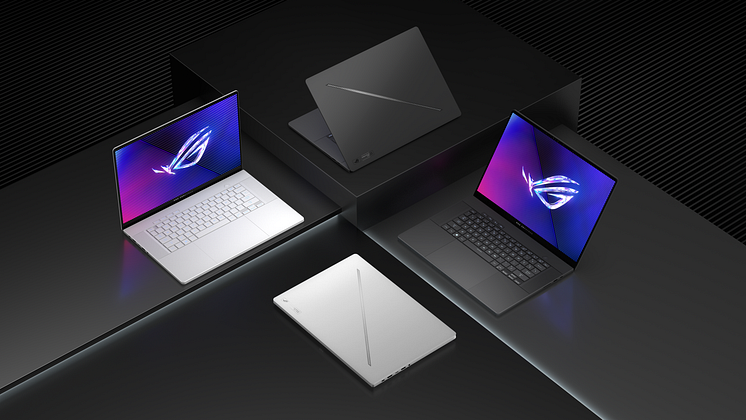 Four 2024 Zephyrus G16 laptops, with two each in Eclipse Gray and Platinum White, sitting on blocks of different heights, with their laptop lids open at different angles, on a dark gray background