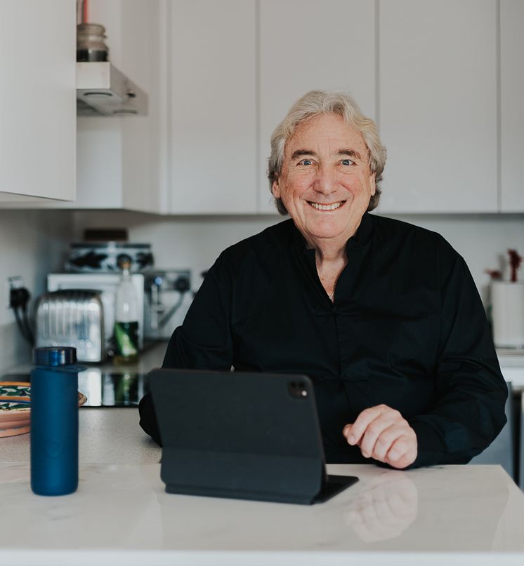 Dave Noble, at workdesk with Bluewater bottle.jpg