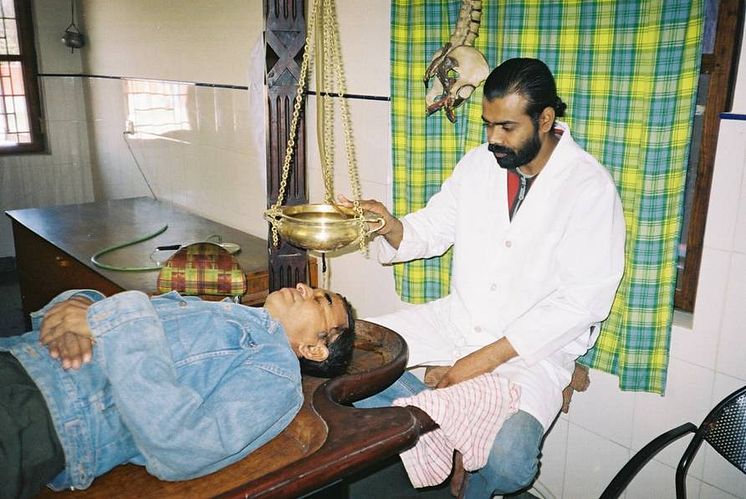 Ayurveda treatment with hot oil at Sambhavna