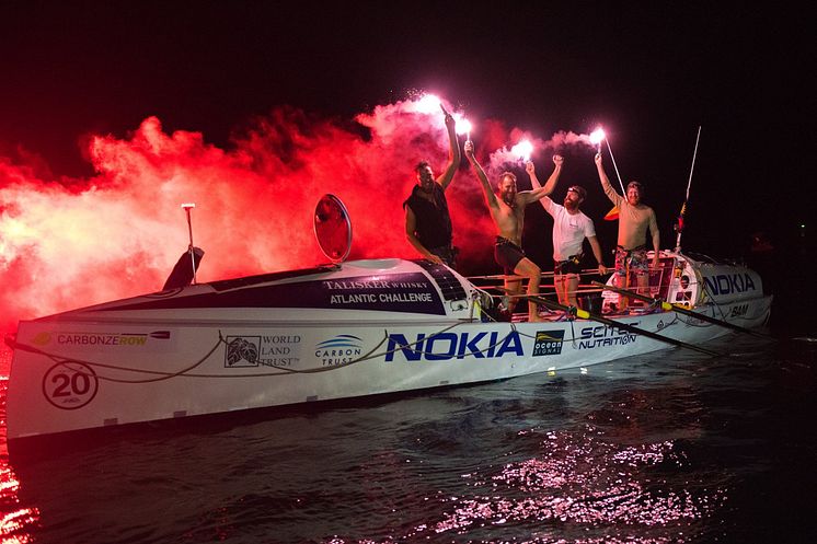 Hi-res image - Ocean Signal - Carbon Zerow, sponsored by Ocean Signal, celebrate after finishing the 2017/18 Talisker Whisky Atlantic Challenge. Credit: Ted Martin