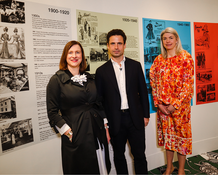 Emma Jane Goldsmith, Leo Fenwick and Kristen Pickering view the timeline at Exhibition 140. Image by Maddie Gunson