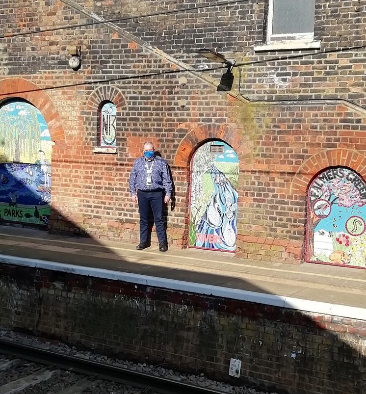 Palmers Green mosaics - station manager Duncan Primrose