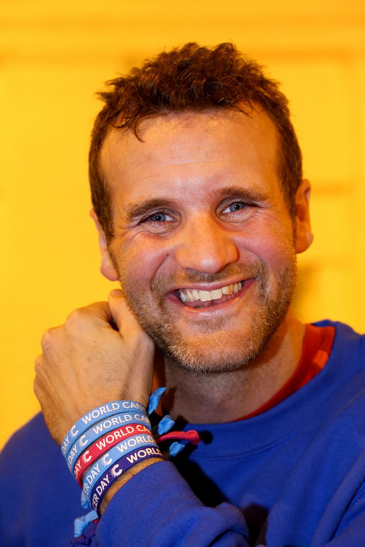 Richard Brown wearing World Cancer Day Unity Bands from Cancer Research UK _