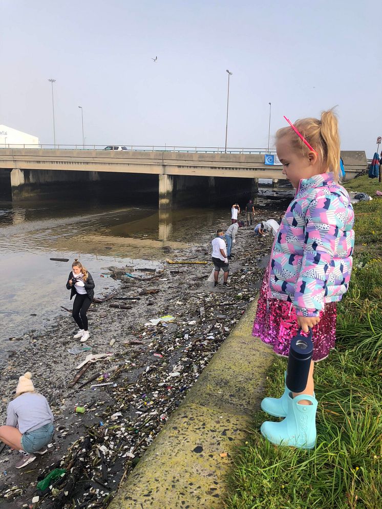 Black River_small kid looks at pollution.jpg