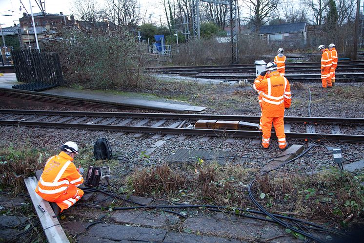 Engineers install new lineside equipment