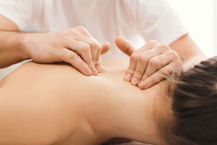woman-getting-classical-back-and-neck-massage-2022-12-16-09-17-57-utc-1