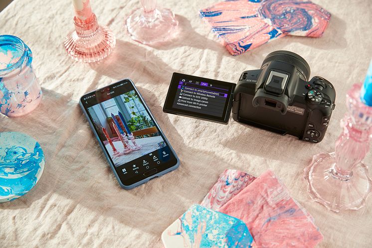 Canon EOS R50-ambient-high-angle-black-camera-marbling-setup-wireless-smartphone-connect