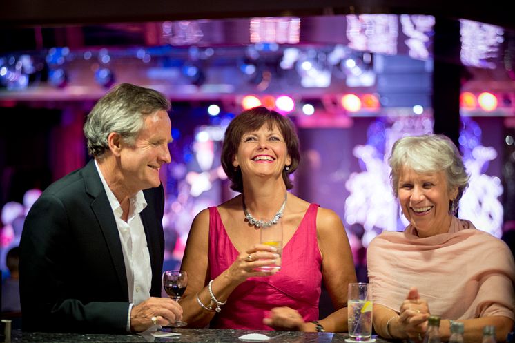 Friends enjoying drinks in the Neptune Lounge