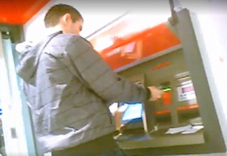 05 Still from covert footage of a cash withdrawal being made