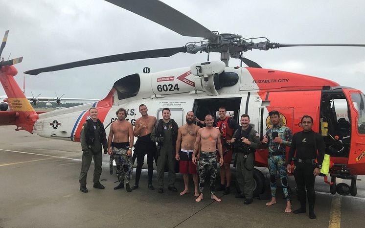 Hi-res image - ACR Electronics - US Coast Guard Fifth District Command Center personnel with the fishermen saved this summer off Cape Henry. Credit: USCG