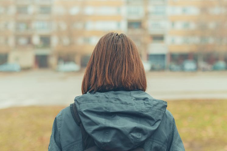 30459722-rear-view-of-woman-on-city-street