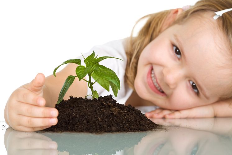 670228-little-girl-happy-about-her-plant.jpg