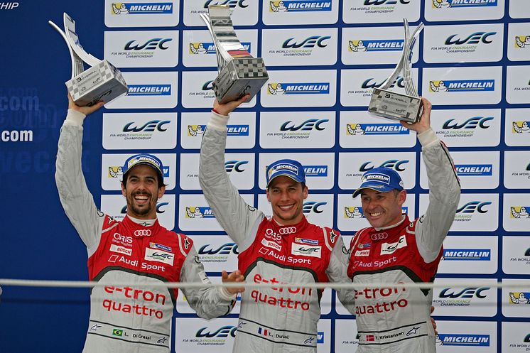 Lucas di Grassi, Loïc Duval, Tom Kristensen on the podium