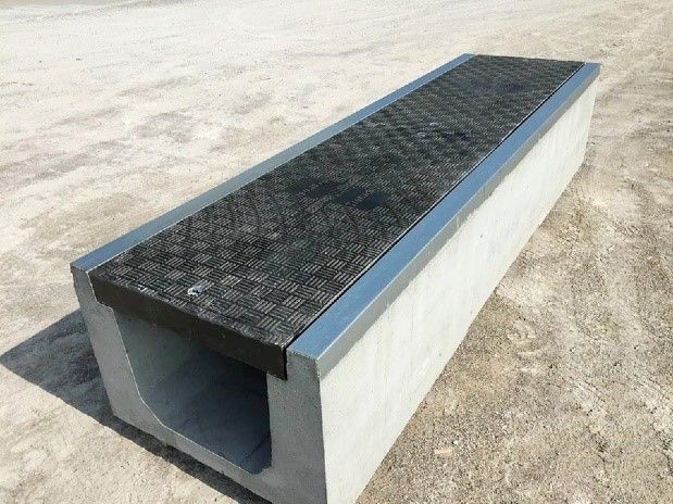 Precast concrete trench systems including Fibrelite covers