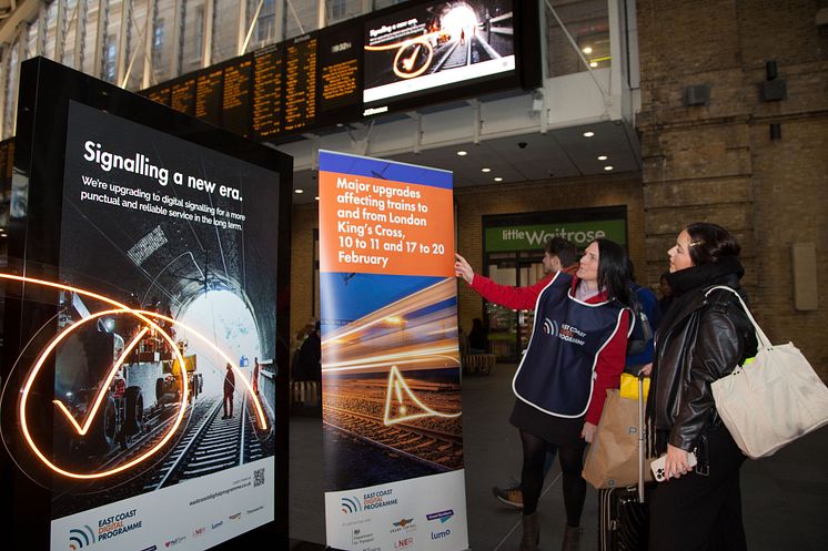 ECDP team talks to passenger at King's Cross, Network Rail