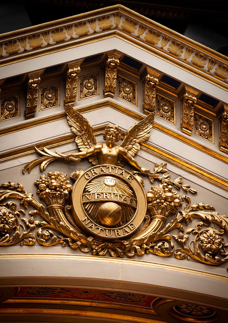 Seal of Uppsala University above the stage of the auditorium
