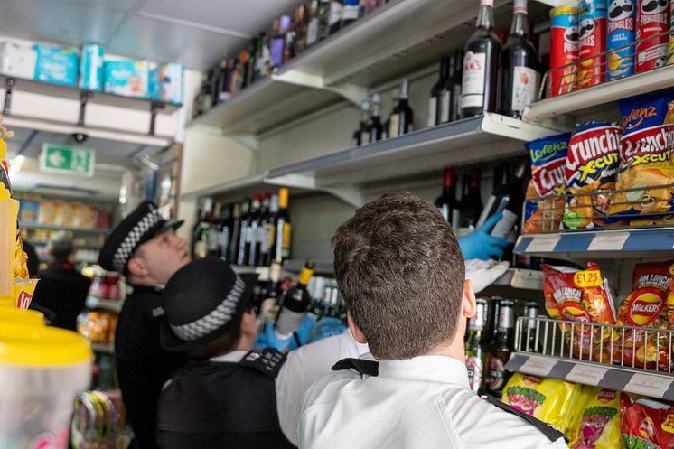 Officers searching one of the shops.jpg
