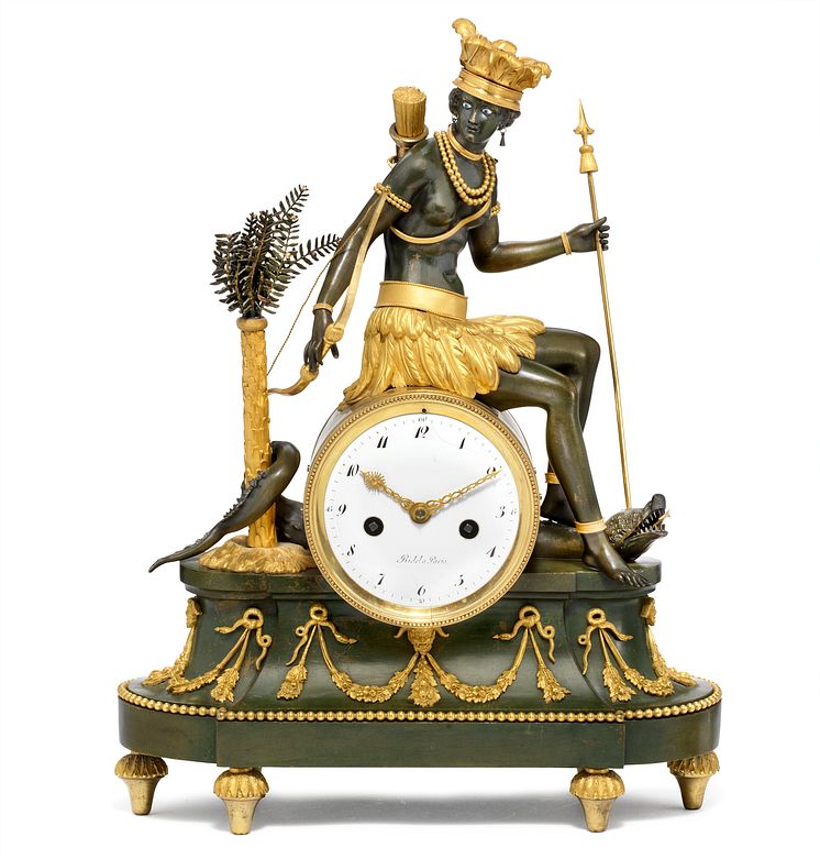 L'Amérique: A Directoire patinated and gilt bronze allegorical mantel clock 'au bon sauvage' with figure personifying America. First quarter 19th century. Estimate: DKK 100,000-150,000 / € 13,500-20,000.