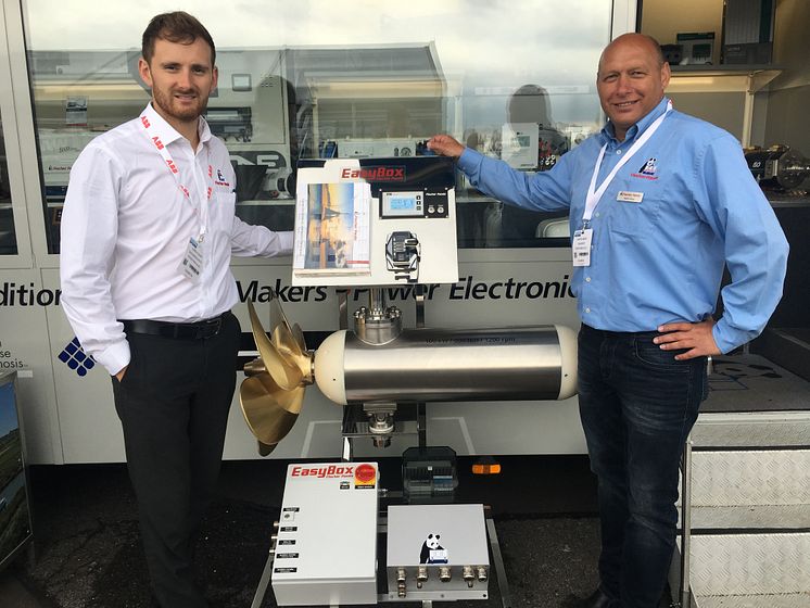 Hi-res image - Fischer Panda UK - Chris Fower, Sales and Marketing Director, Fischer Panda UK, and Martin Mews, Diesel-Electric Propulsion Systems Specialist at Fischer Panda GmbH, with the new 100 kW electric motor at Seawork International