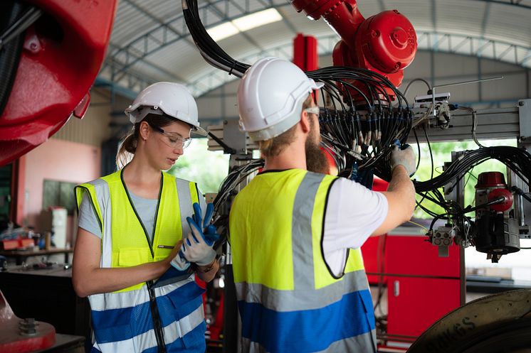 1 Woman and man with robotics - WOSUNA_Shutterstock_2315299093