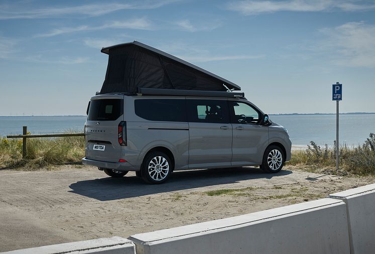 2024FordTransitNuggetLWBTitanium_3.2_3-4_rear.jpg