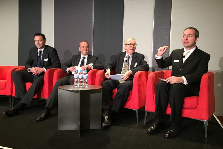 Mark Laudi moderating panel in Sydney