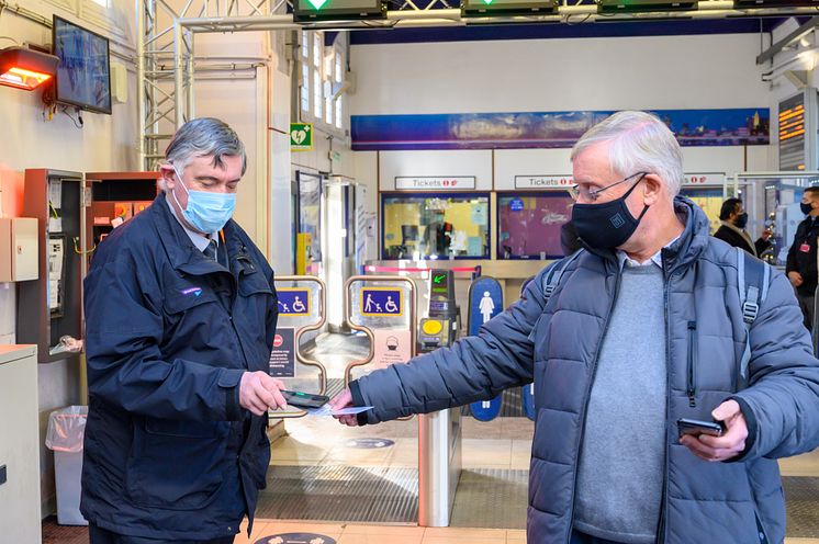 Neil Middleton, of Rail Future Hertfordshire and Bedfordshire, has his key smartcard checked at Hitchin station