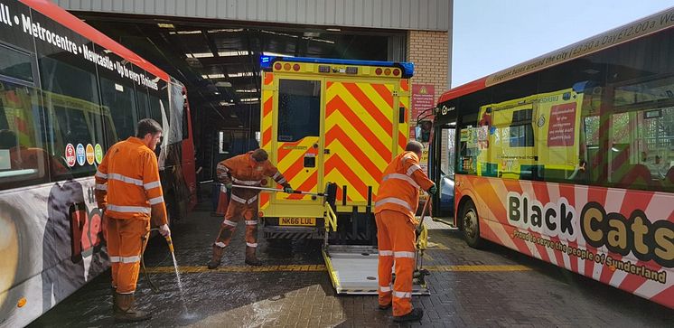 Team members at Go North East's depot in Sunderland helping clean ambulances