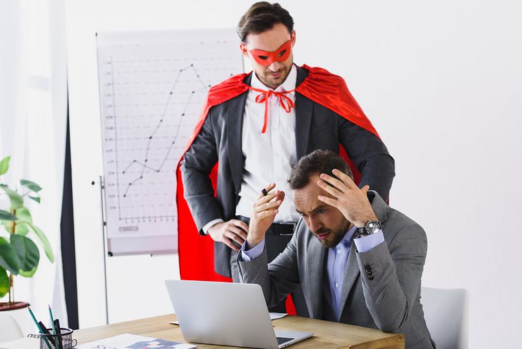 26160232-super-businessman-in-mask-and-cape-helping-angry
