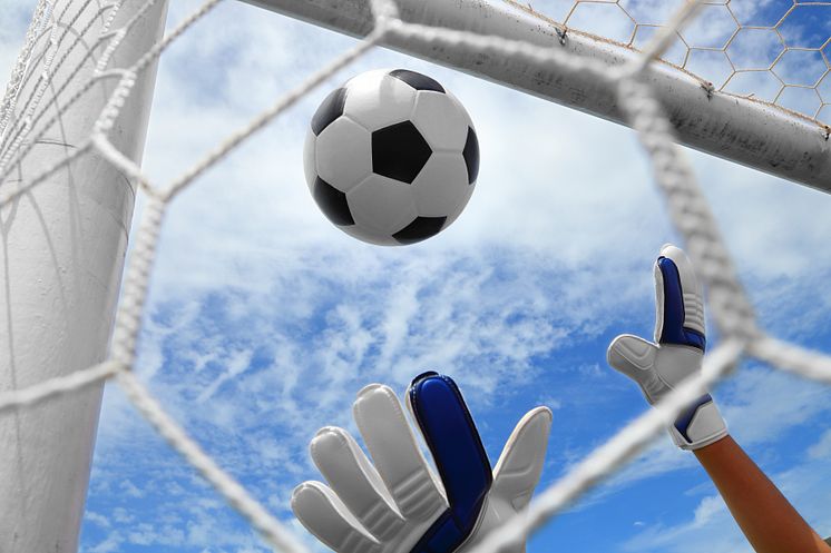 5519057-goalkeeper-s-hands-fail-catching-the-soccer-ball-on