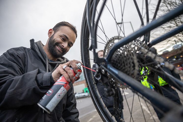Mechanic Ethan Masih servicing a bike
