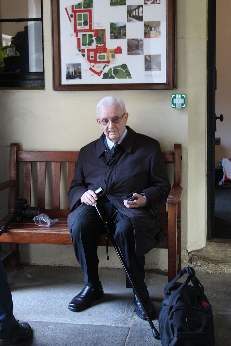 Jimmy, waiting for Stanley at the almshouse entrance