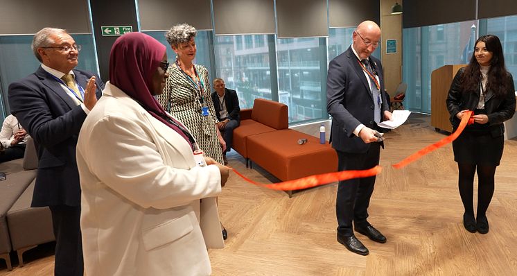 06 HMRC staff help Jim Harra cut the ribbon