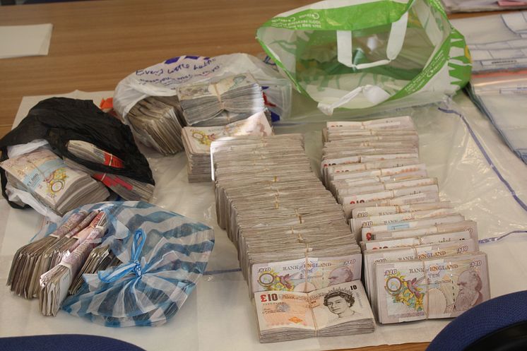 £15m fraud gang jailed - £98,990 of the seized cash