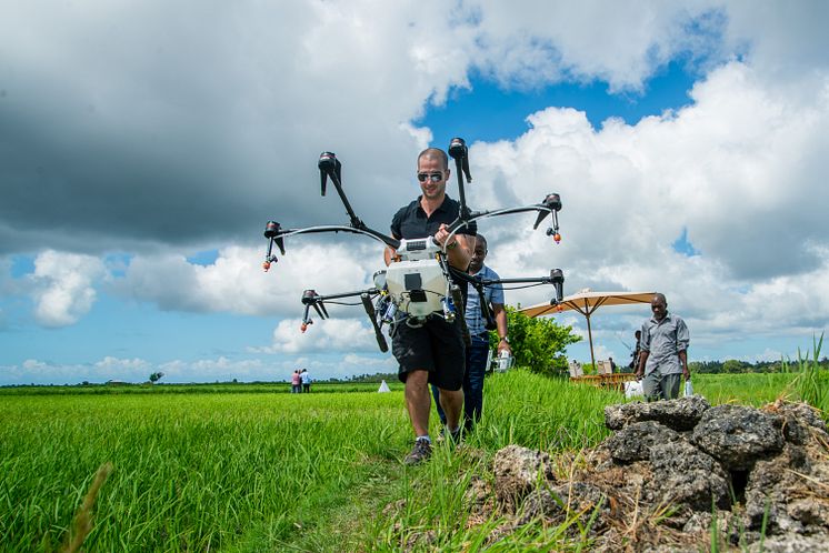 DJI Agras MG1-S arriving on the rice fields in Africa
