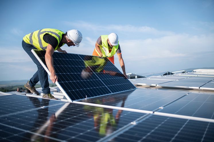 installers-rooftop-solar-panels-getty-1405880267
