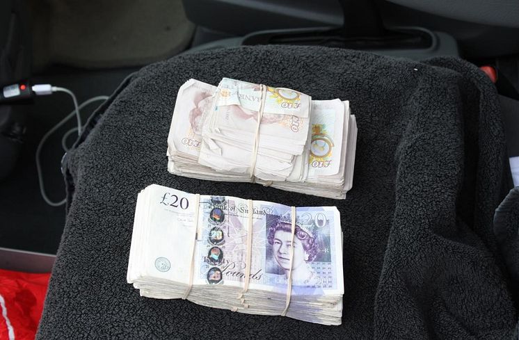 EM 04 18 Cash seized from a gang member's car