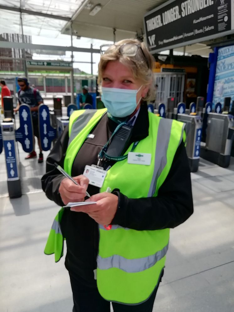 Social distancing at East Croydon station - staff member
